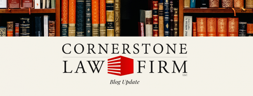 Photo of books with the Cornerstone Law Firm logo and the title "Blog Update"