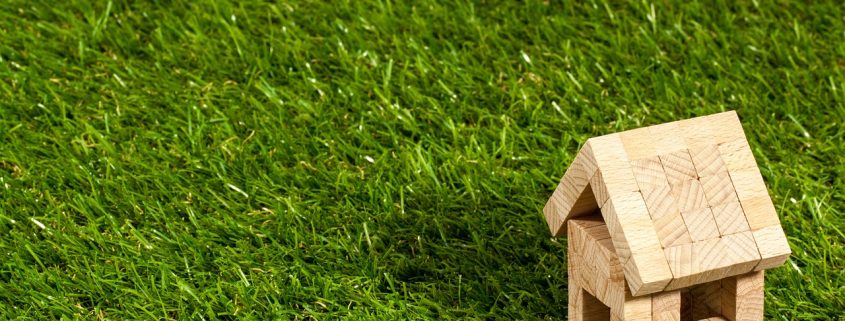 A small wooden house in the grass