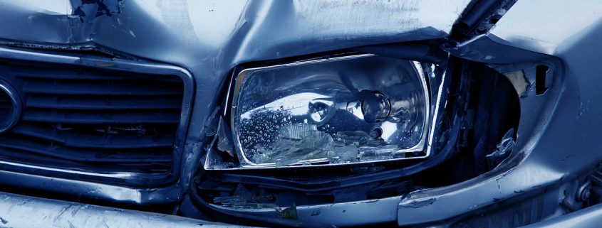 A close up of a smashed car hood