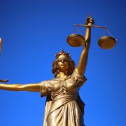 A Lady Justice statue holding scales and a sword