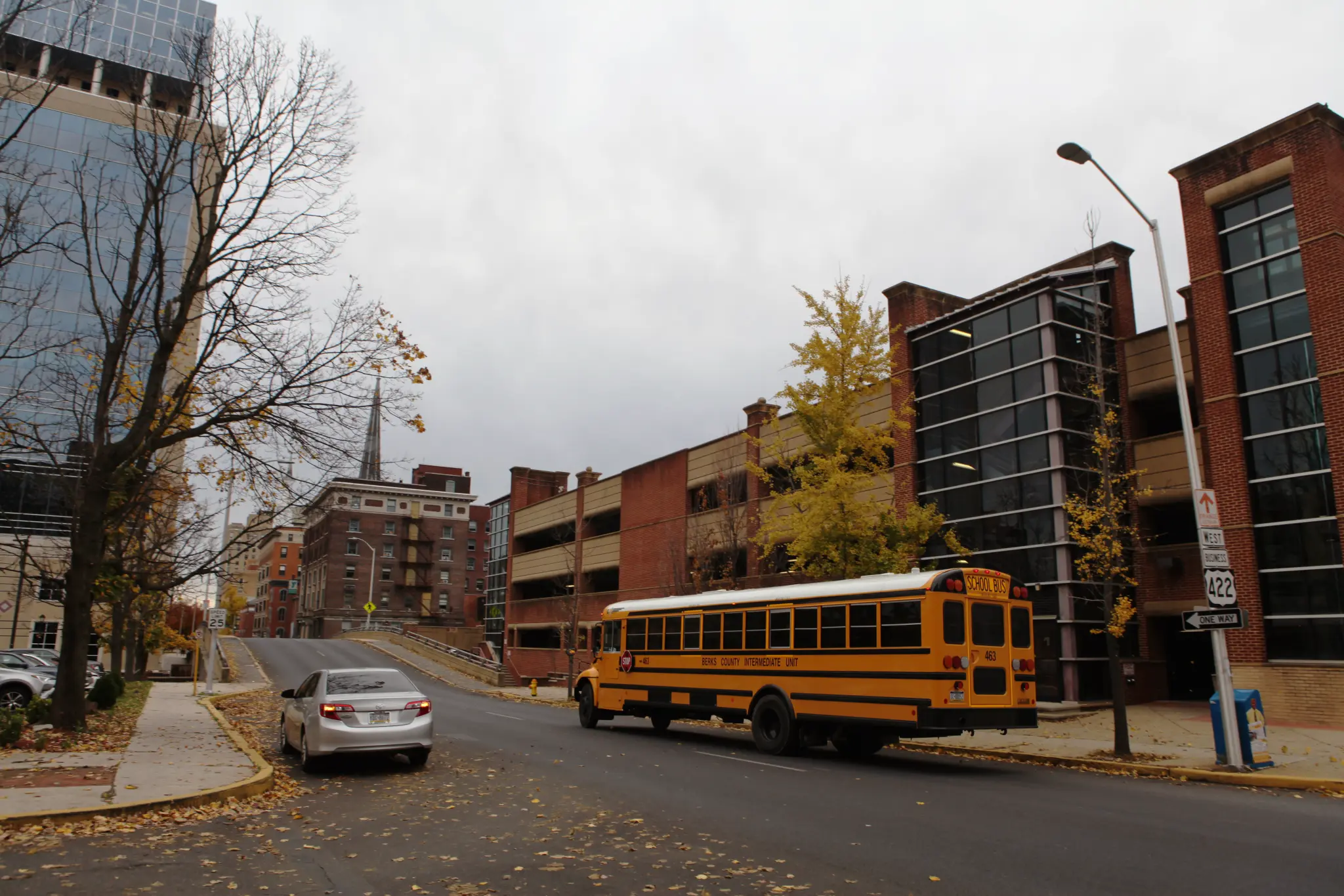A Berks County Intermediate Unit school bus driving through downtown Reading on a rainy fall day