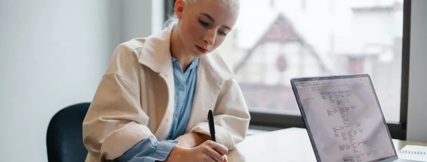 A woman signing a short certificate