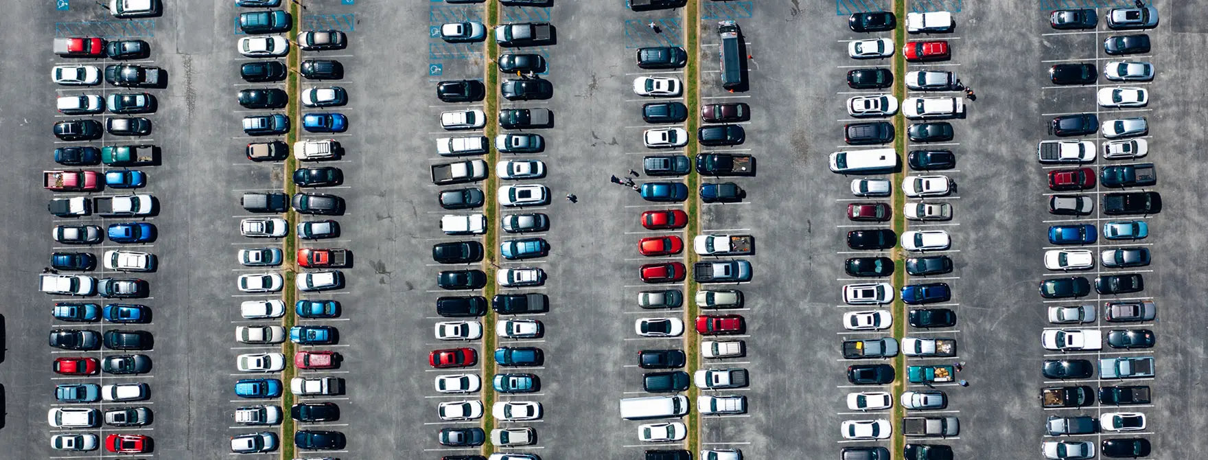 An aerial shot of a full parking lot
