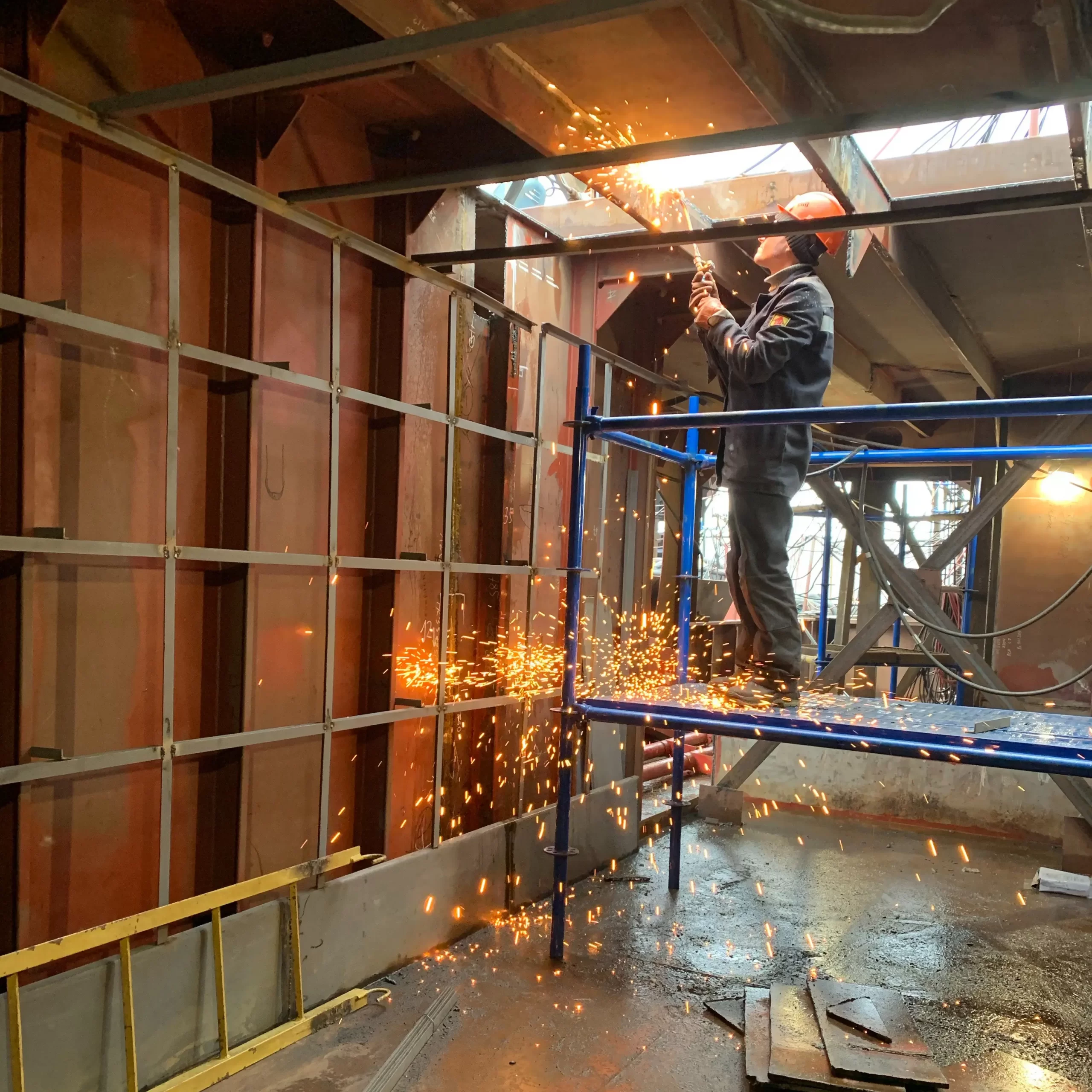 A contractor doing electrical work in a building under construction