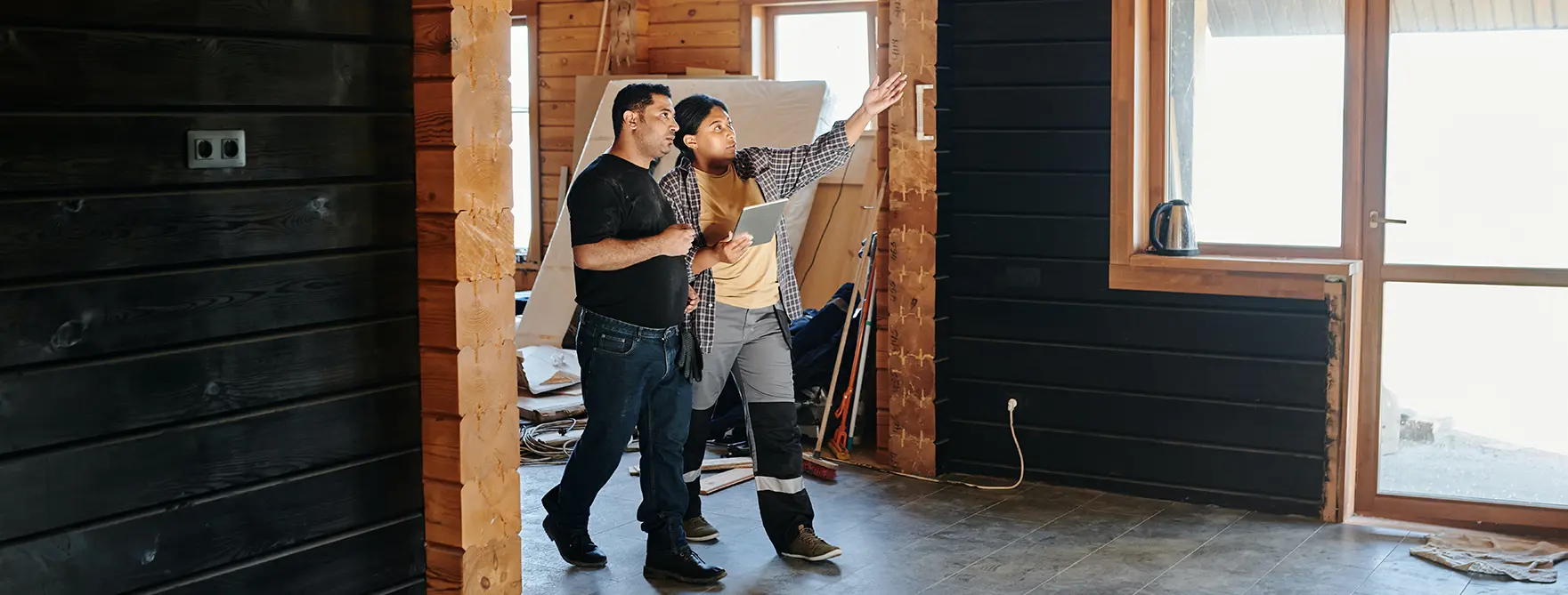 A contractor doing a walkthrough with her client