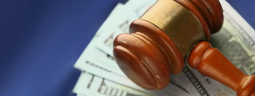 A gavel resting on money