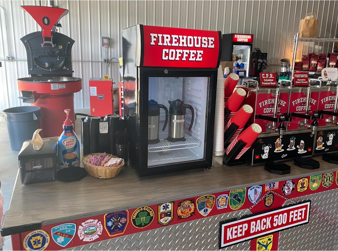 The counter at Firehouse Coffee, with creamers, coffee cups, and different blends of coffee