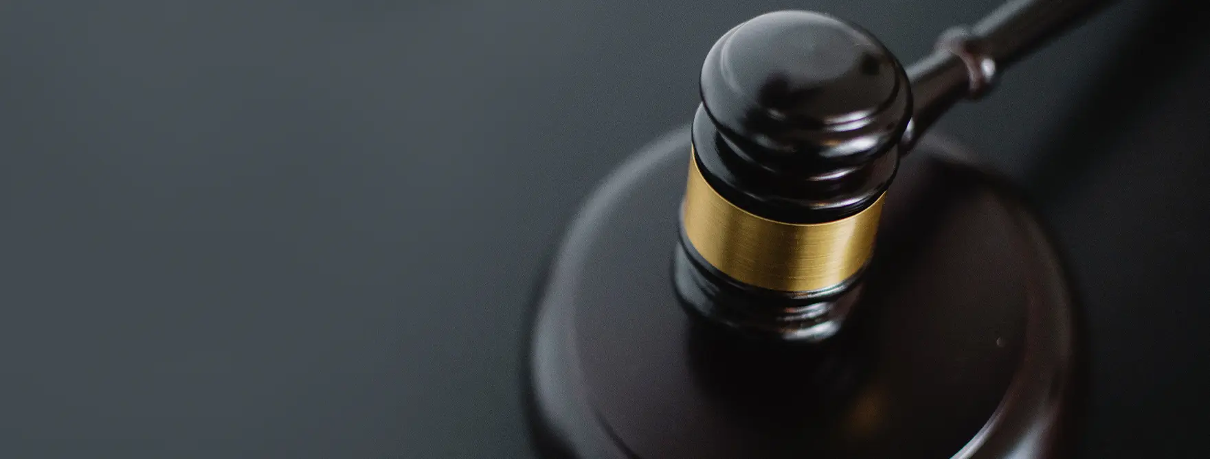 A gavel resting on a sound block