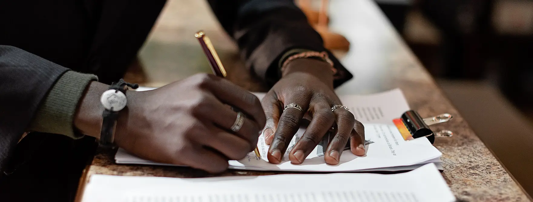 Someone signing an estate document