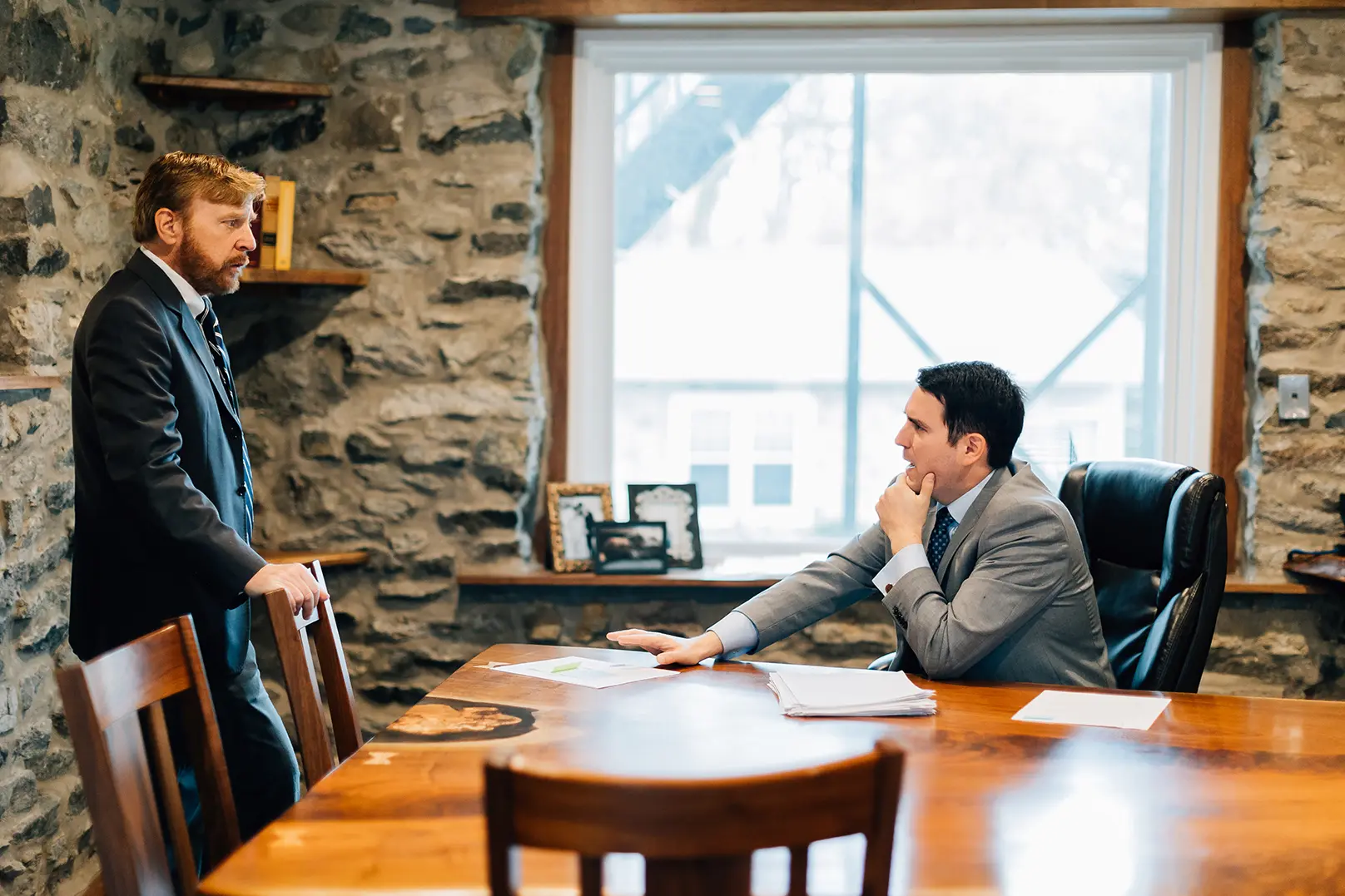 A Cornerstone attorney having a serious discussion with a Cornerstone paralegal