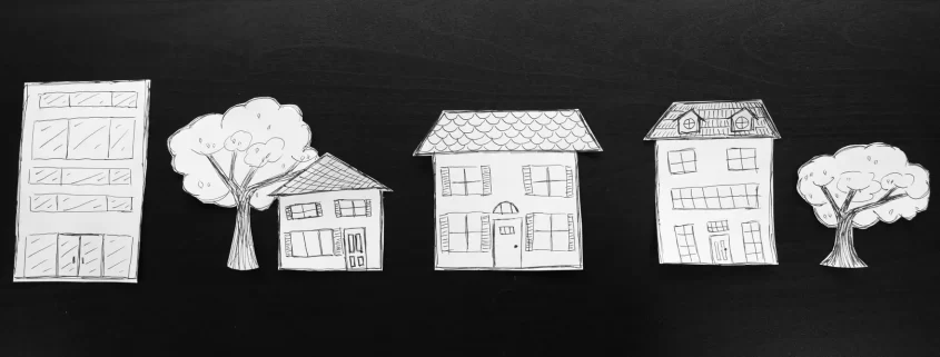 A row of paper houses and trees