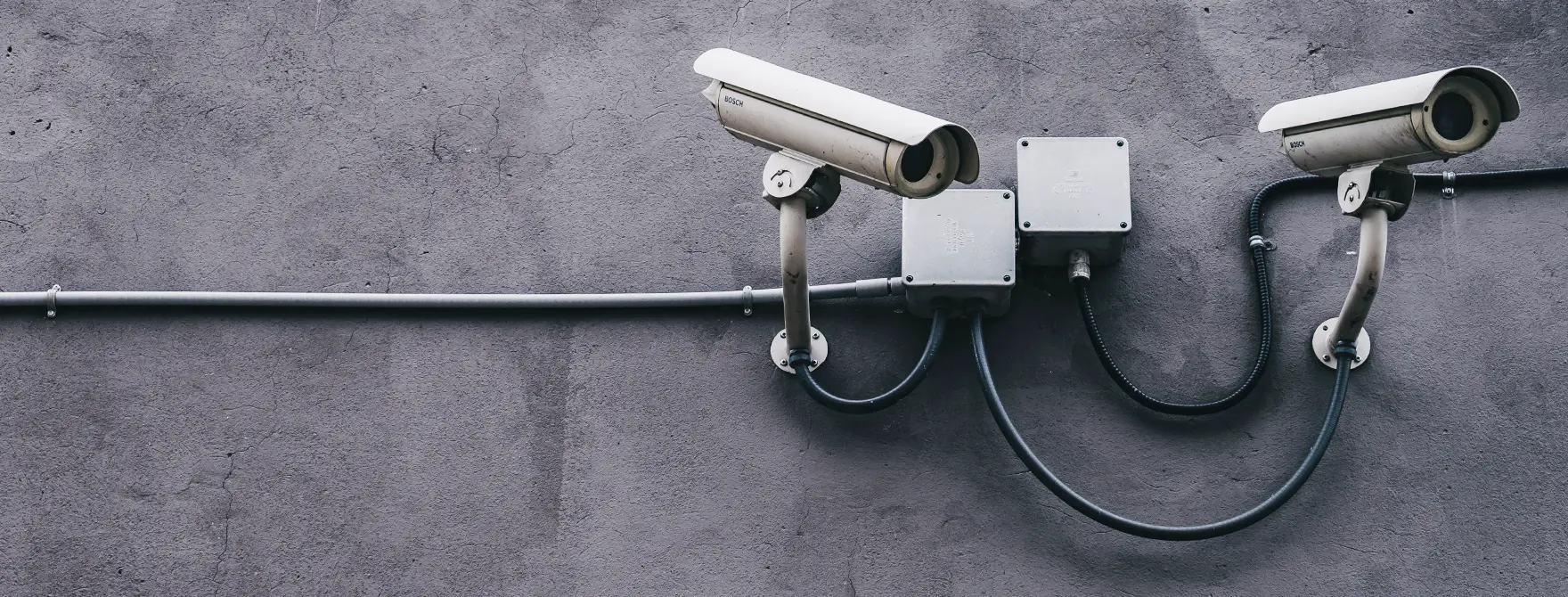 Security cameras mounted on the side of a building