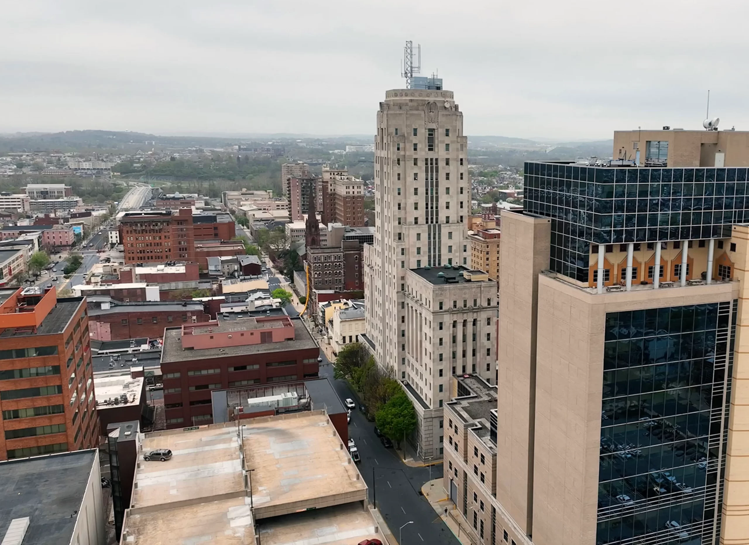 A photo of downtown Reading, PA with the courthouse at the center. The sky is overcast in the background.