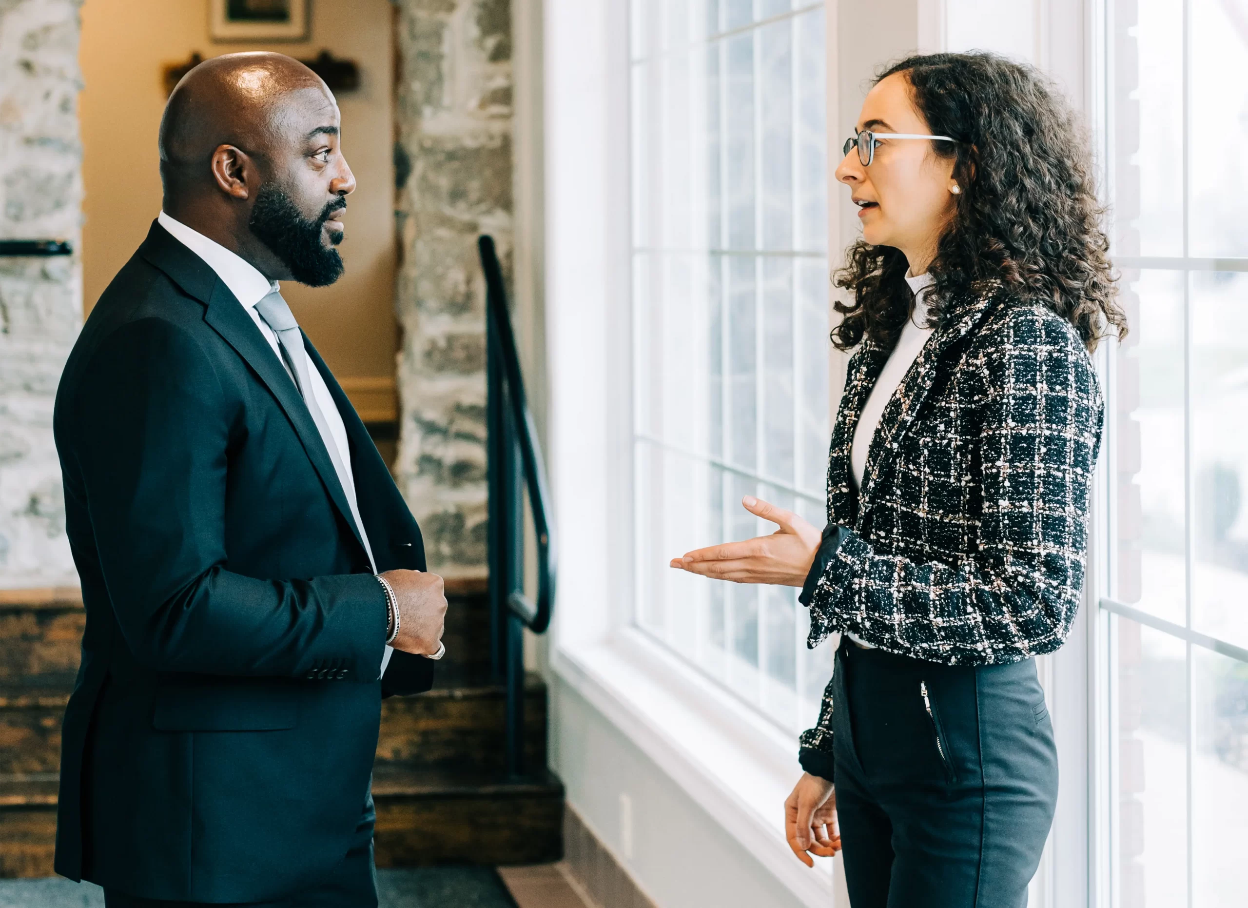 Attorney Browne speaking with Attorney Caloia at Cornerstone Law Firm.