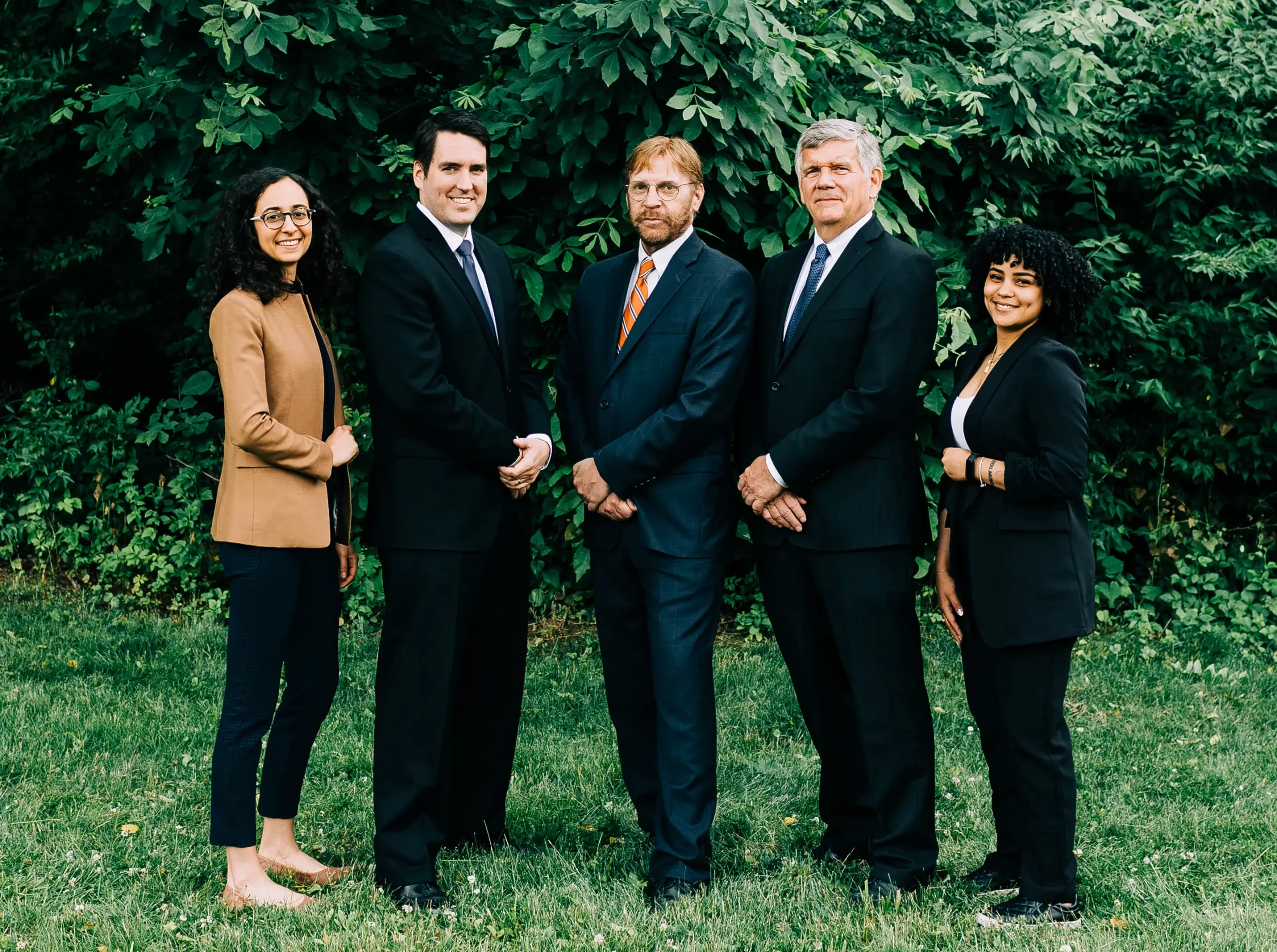 A group photo of the personal injury team at Cornerstone Law Firm, with 3 attorneys and 2 paralegals.