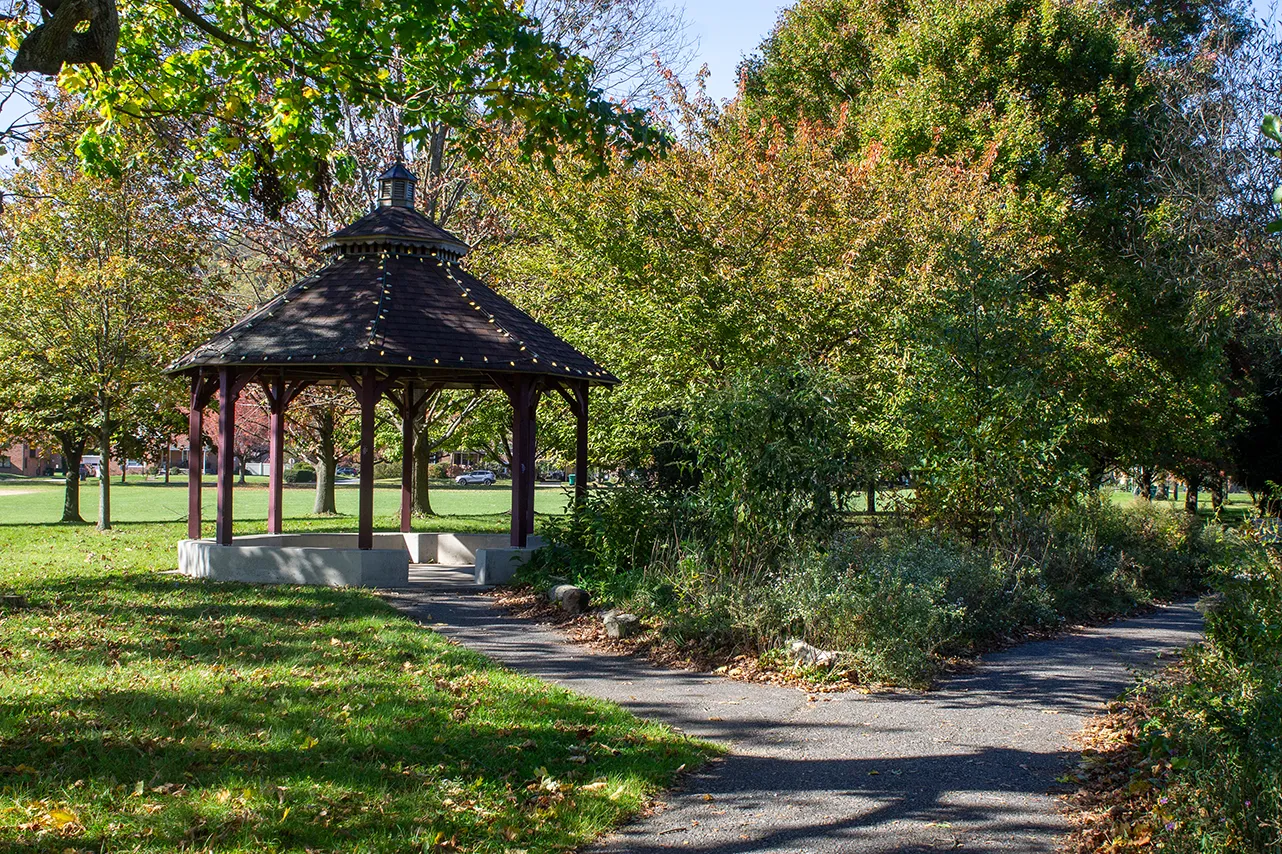 A photo of a gazebo with lights on it at Carsonia Park on a sunny day