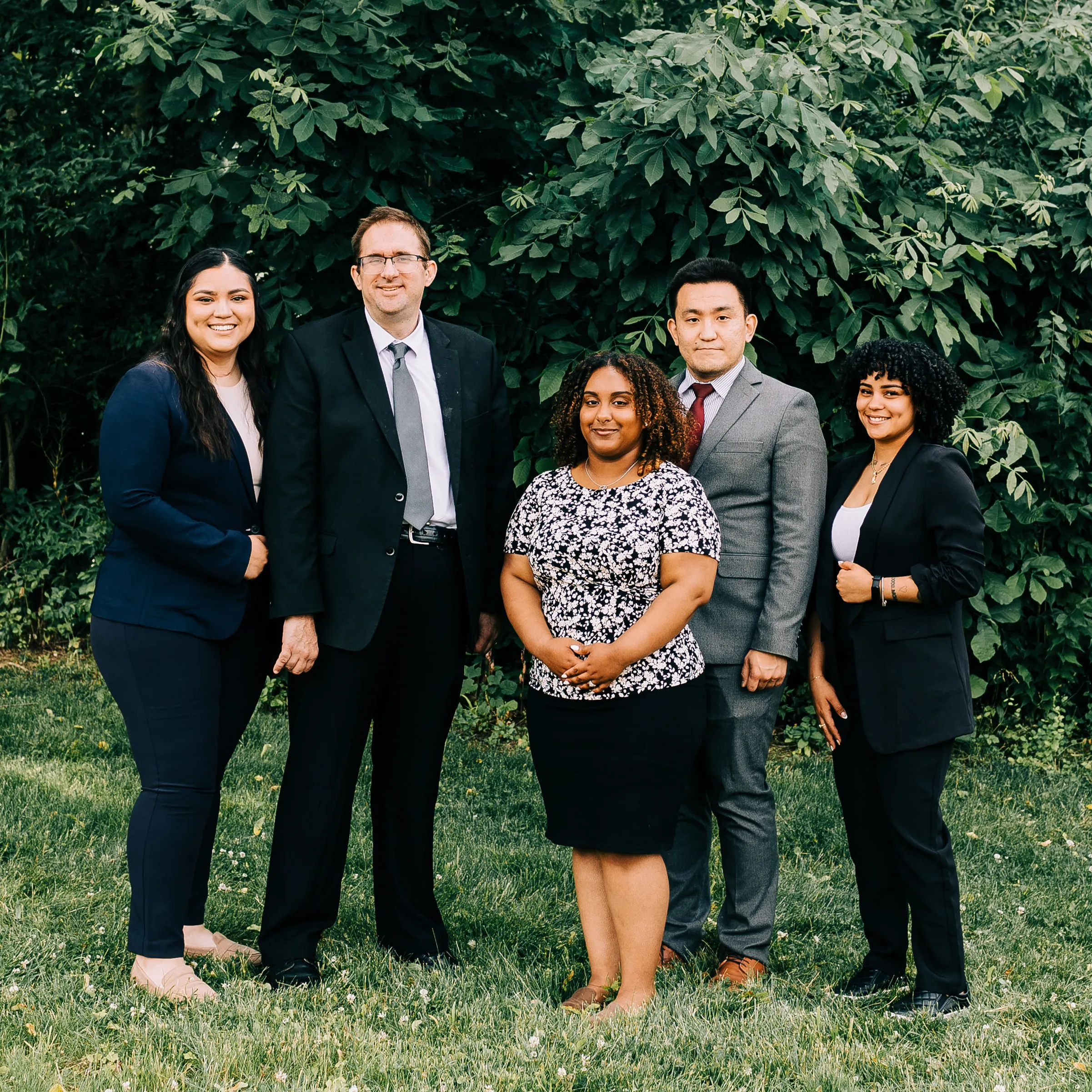 The two attorneys and 3 staff that make up the immigration team at Cornerstone Law Firm