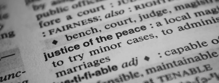 Close up of a dictionary definition for "Justice of the peace"