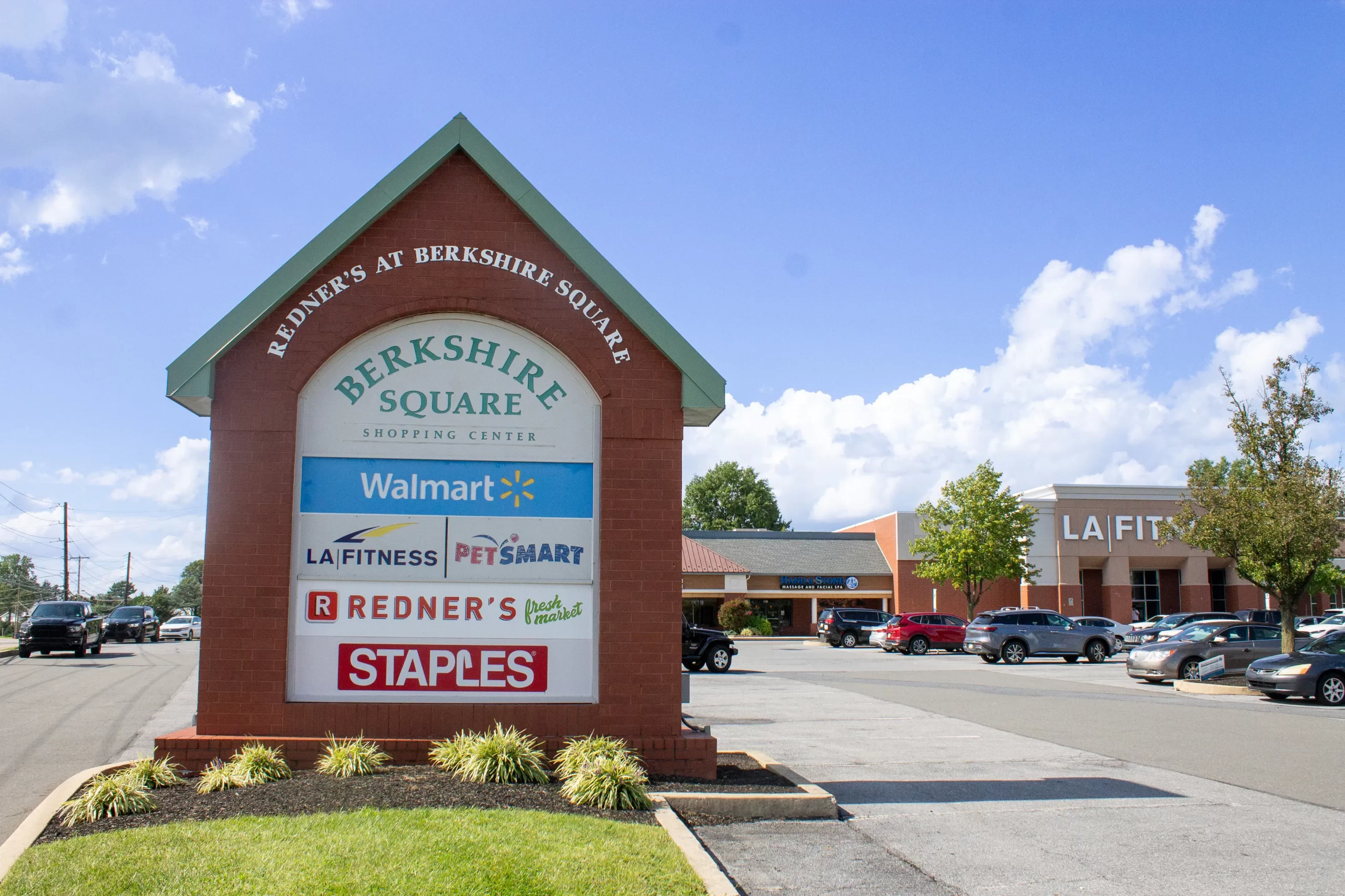 A photo of the different shop signs at Berkshire Square on a sunny day.