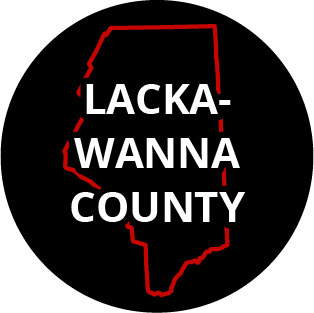 The words "Lackawanna County" in a black circle with red outline of the county behind it. The image links to a page listing the county's Magisterial District Courts.