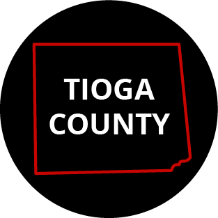 The words "Tioga County" in a black circle with red outline of the county behind it. The image links to a page listing the county's Magisterial District Courts.