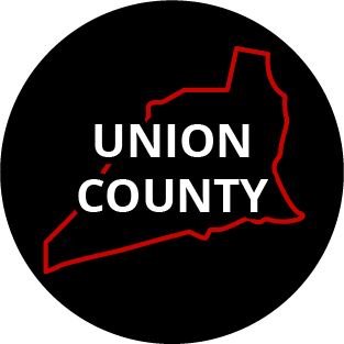 The words "Union County" in a black circle with red outline of the county behind it. The image links to a page listing the county's Magisterial District Courts.
