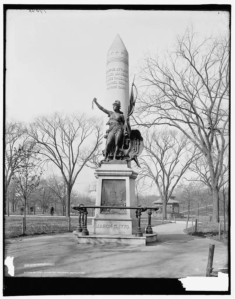A black and white photo of the Boston Massacre Monument