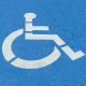A blue handicap space marker