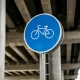 A blue bicycle road sign