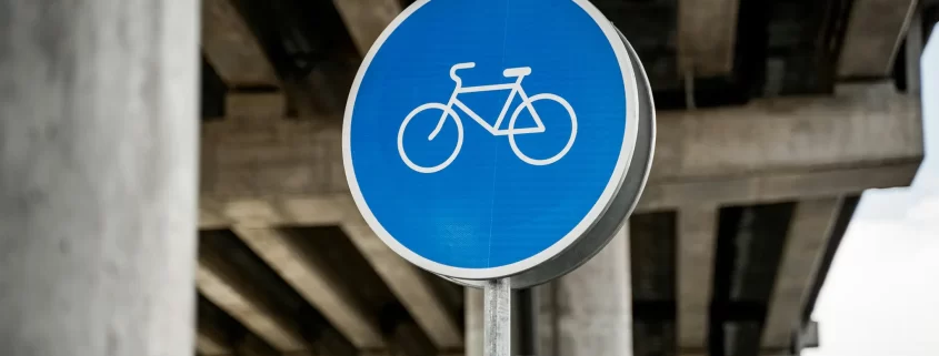 A blue bicycle road sign