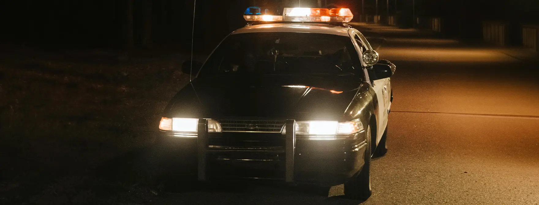 A police cruiser at night