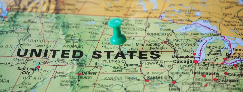 A map of the United States with a push pin in it