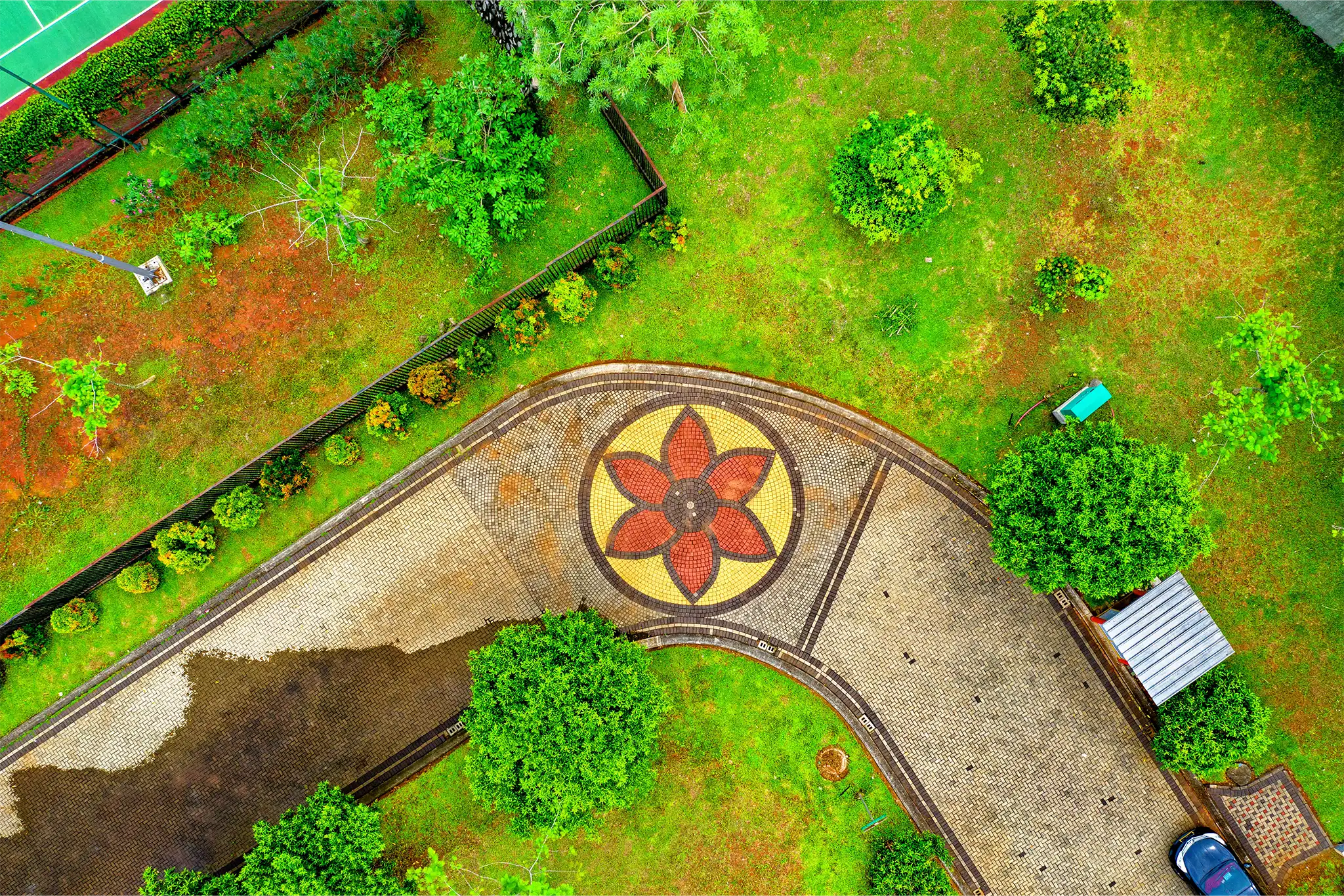 An overhead view of a backyard with a floral walkway