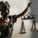 A Lady Justice statue holding some scales