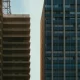 A residential building next to a commercial building