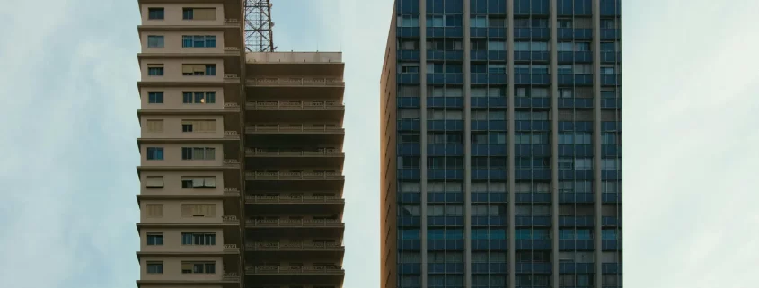 A residential building next to a commercial building