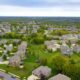 An aerial shot of a housing development to represent real property