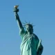 The Statue of Liberty against a clear blue sky