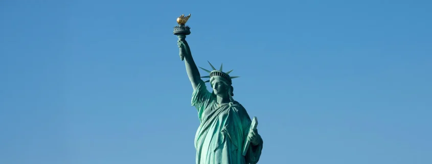 The Statue of Liberty against a clear blue sky